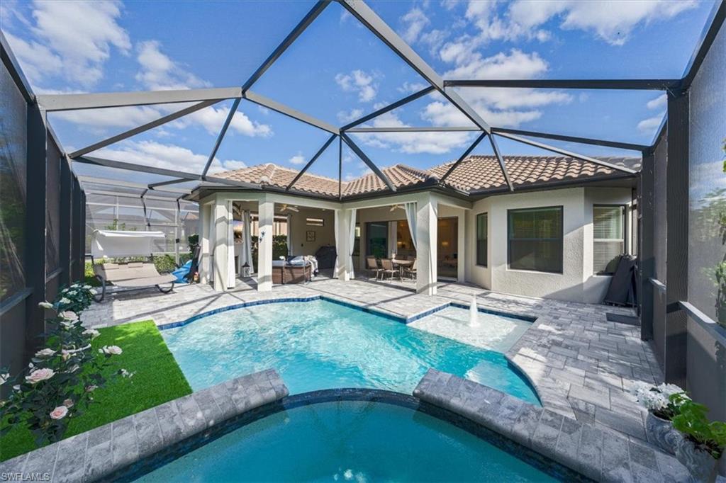 23734 Pebble Pointe Lane Estero, FL 34135 - Photo 19 of 34 a view of a house with backyard porch and sitting area