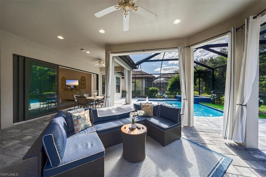 23734 Pebble Pointe Lane Estero, FL 34135 - Photo 25 of 34 a living room with furniture and a large window