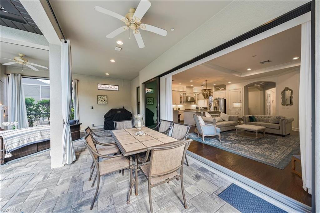 23734 Pebble Pointe Lane Estero, FL 34135 - Photo 26 of 34 a living room with furniture and a large window