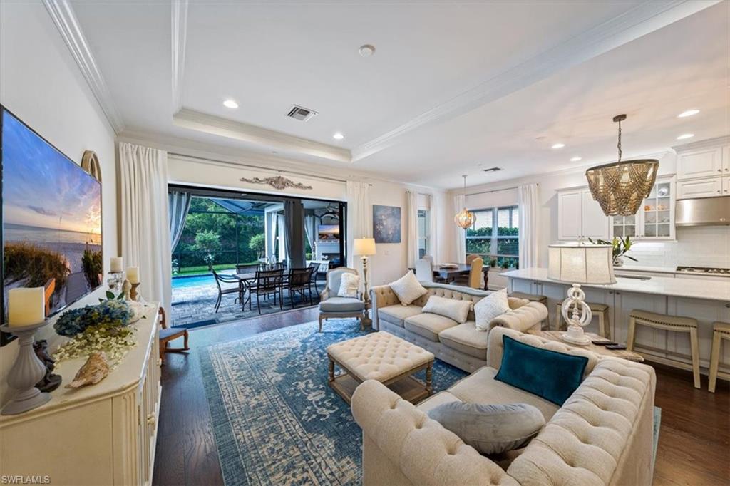 23734 Pebble Pointe Lane Estero, FL 34135 - Photo 3 of 34 a living room with furniture and a large window