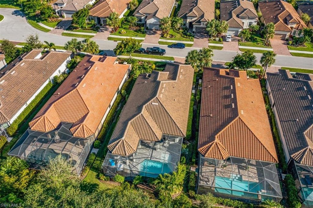 23734 Pebble Pointe Lane Estero, FL 34135 - Photo 32 of 34 an aerial view of a house with a yard and outdoor seating