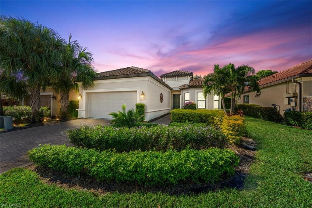 23734 Pebble Pointe Lane Estero, FL 34135 - Photo 33 of 34 a front view of a house with a yard