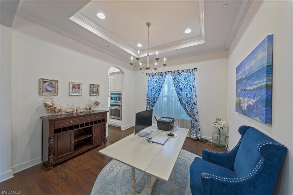 23734 Pebble Pointe Lane Estero, FL 34135 - Photo 10 of 34 a living room with furniture and a chandelier