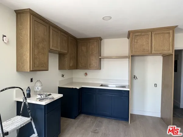 a kitchen with a sink and cabinets