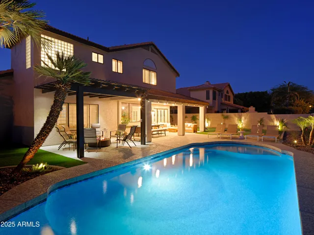 a view of a house with swimming pool