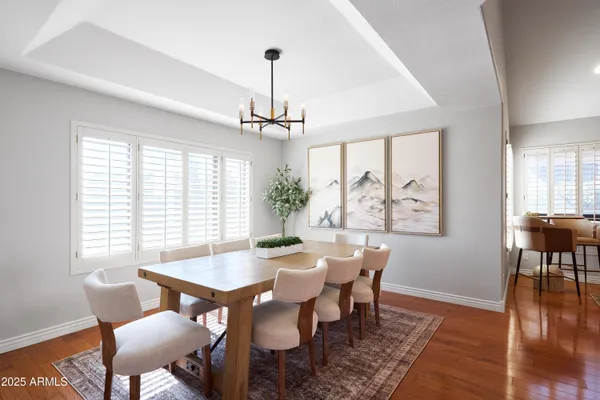 a view of a dining room with furniture window and wooden floor