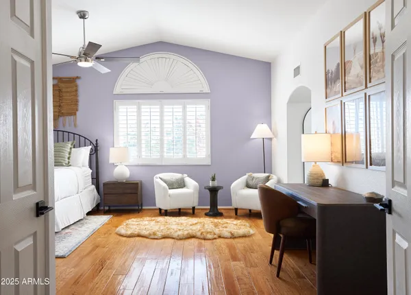 a view of a livingroom with furniture and a window