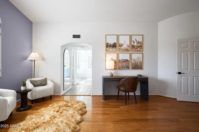 a living room with furniture and a window