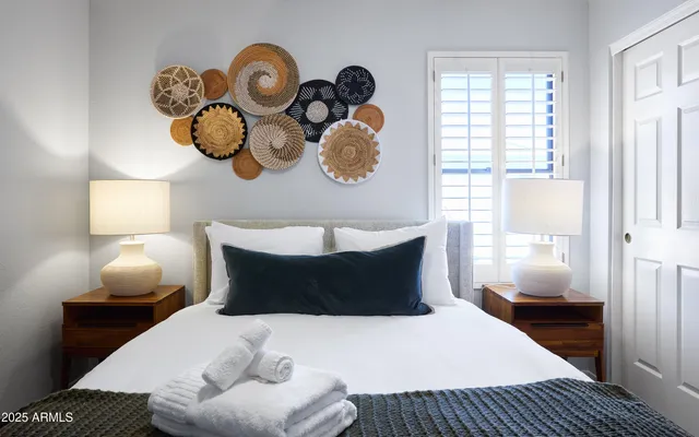 a bedroom with bed and window