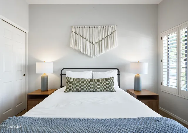 a bedroom with a bed and window