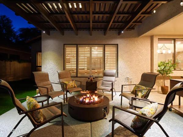 an aerial view of residential houses with outdoor space and pool