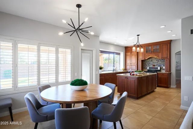 a kitchen with a table and chairs in it