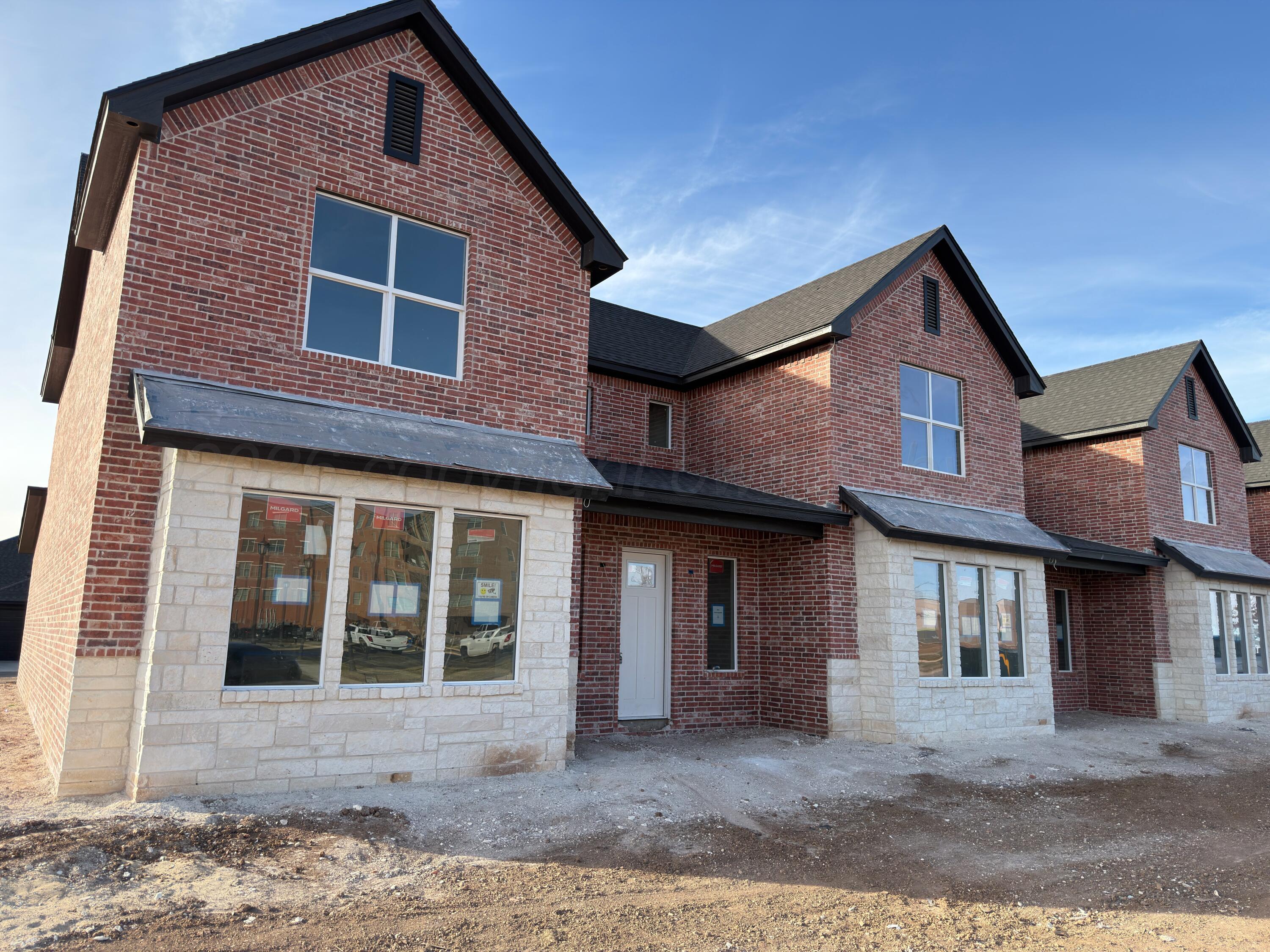 5506 Union Square Amarillo, TX 79119 - Photo 2 of 3 a front view of a house with a yard
