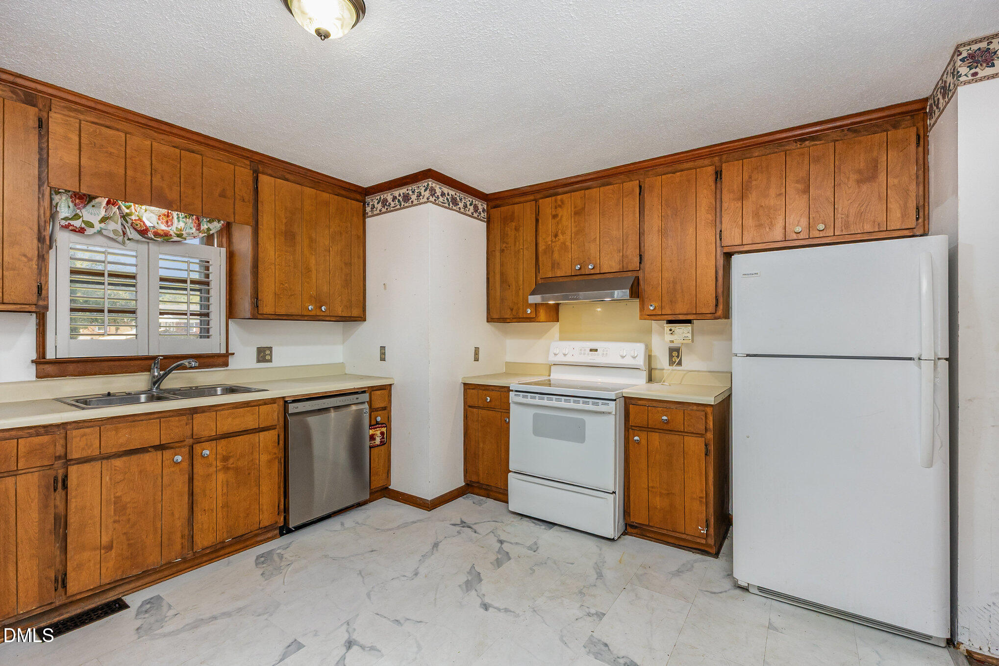2111 Fieldcrest Road East Wilson, NC 27893 - Photo 13 of 37 a kitchen with sink cabinets and refrigerator
