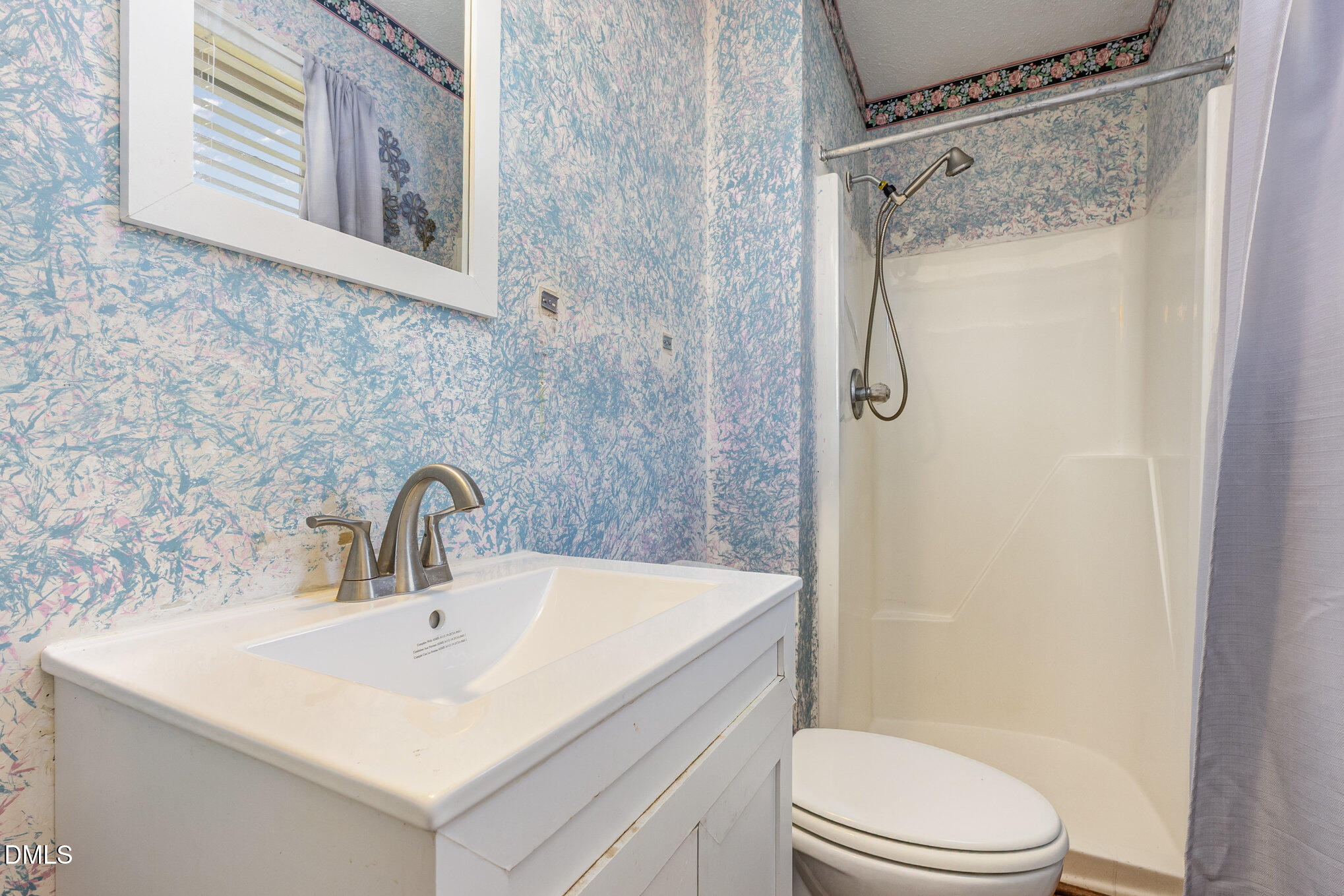 2111 Fieldcrest Road East Wilson, NC 27893 - Photo 25 of 37 a bathroom with a sink toilet and shower