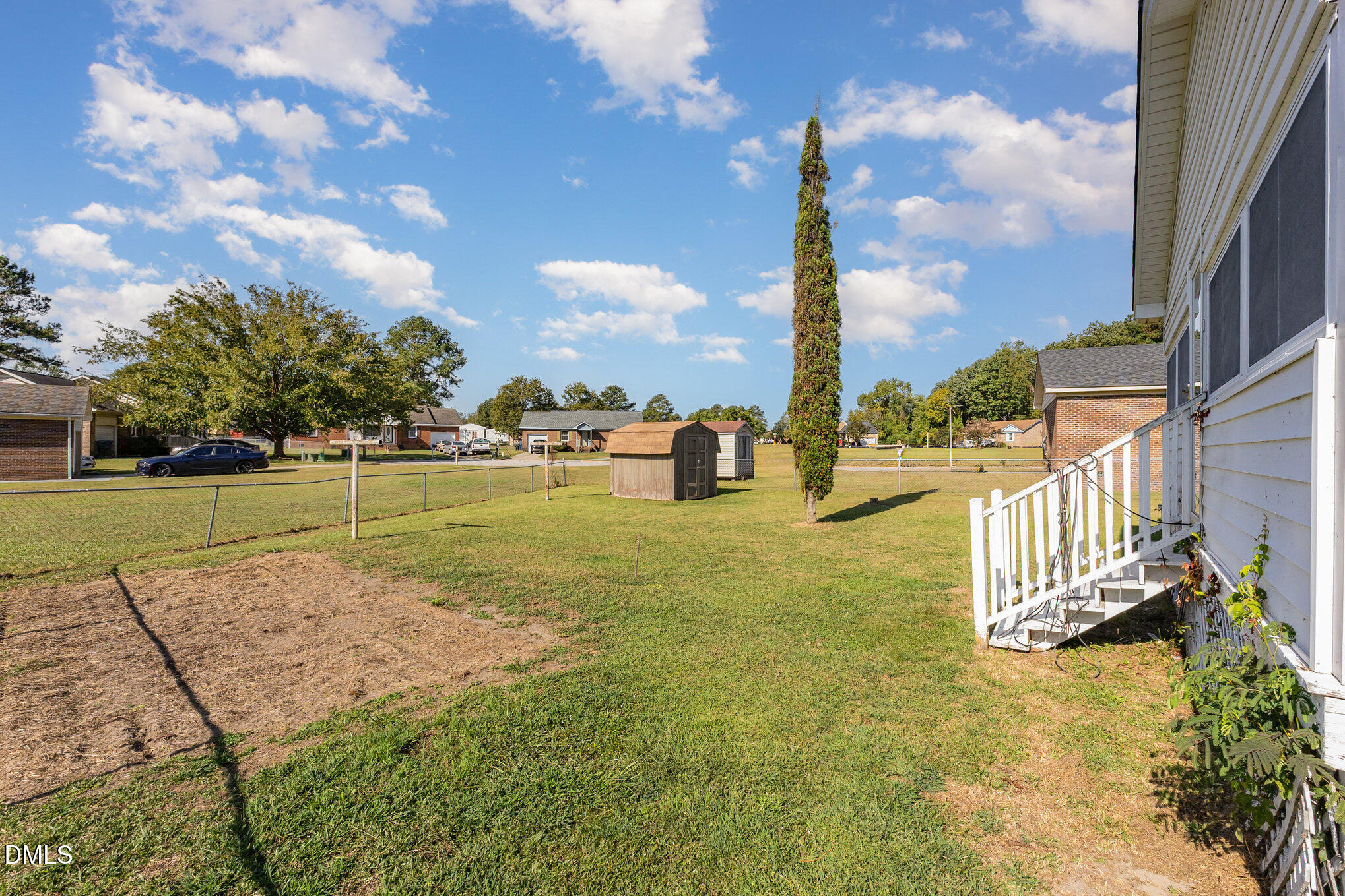 2111 Fieldcrest Road East Wilson, NC 27893 - Photo 35 of 37 a view of a garden with a building