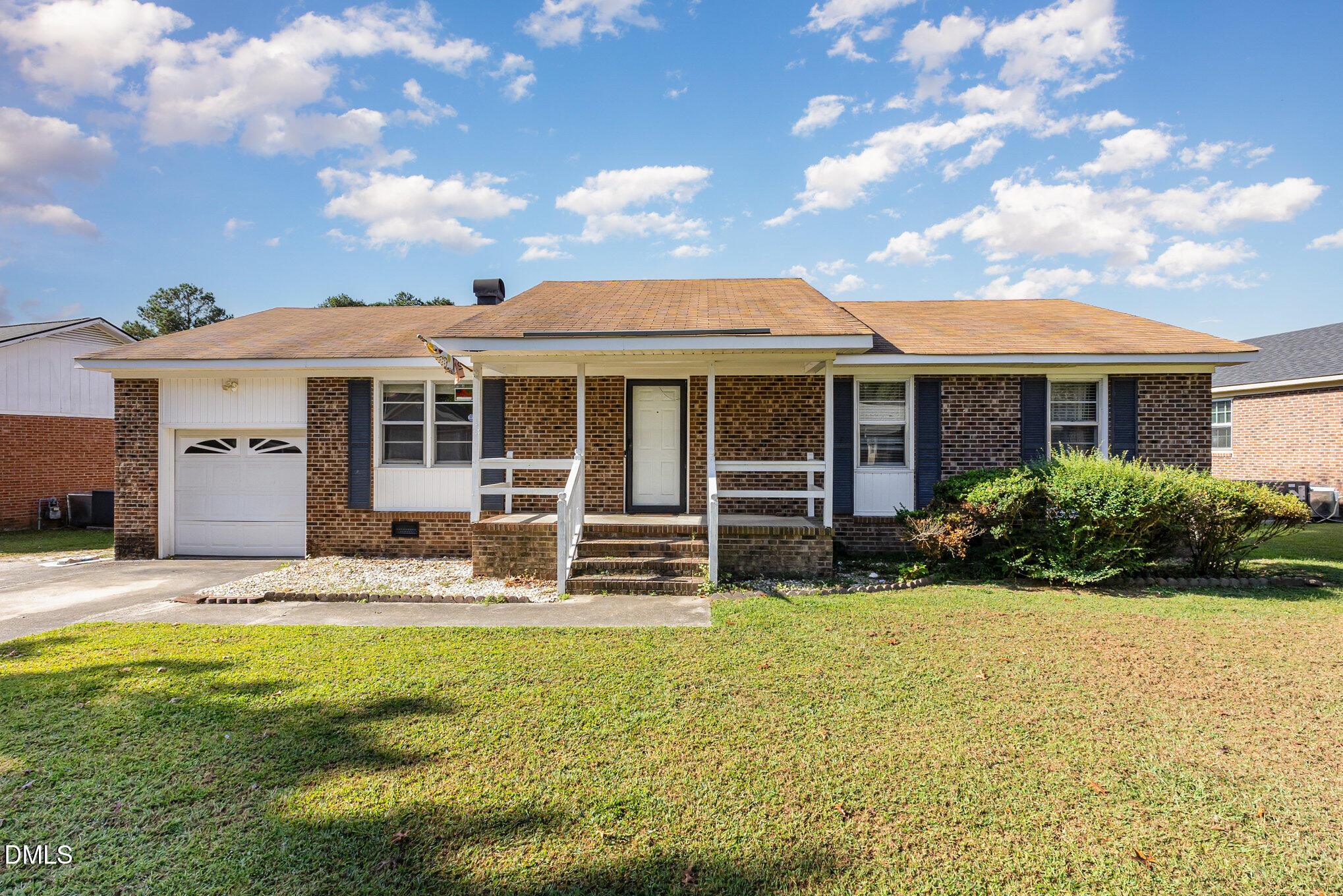 2111 Fieldcrest Road East Wilson, NC 27893 - Photo 4 of 37 a front view of a house with garden