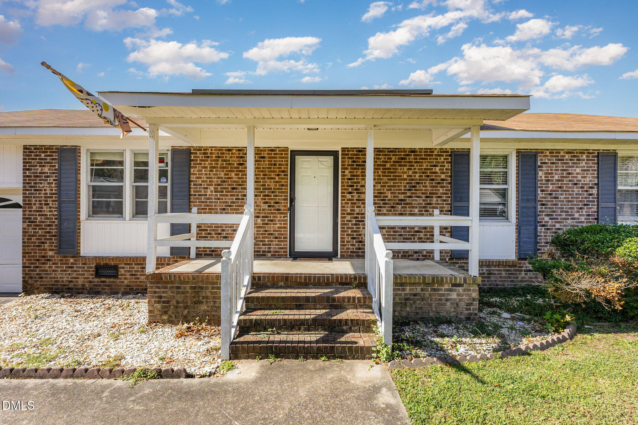 2111 Fieldcrest Road East Wilson, NC 27893 - Photo 5 of 37 a front view of a house with a porch