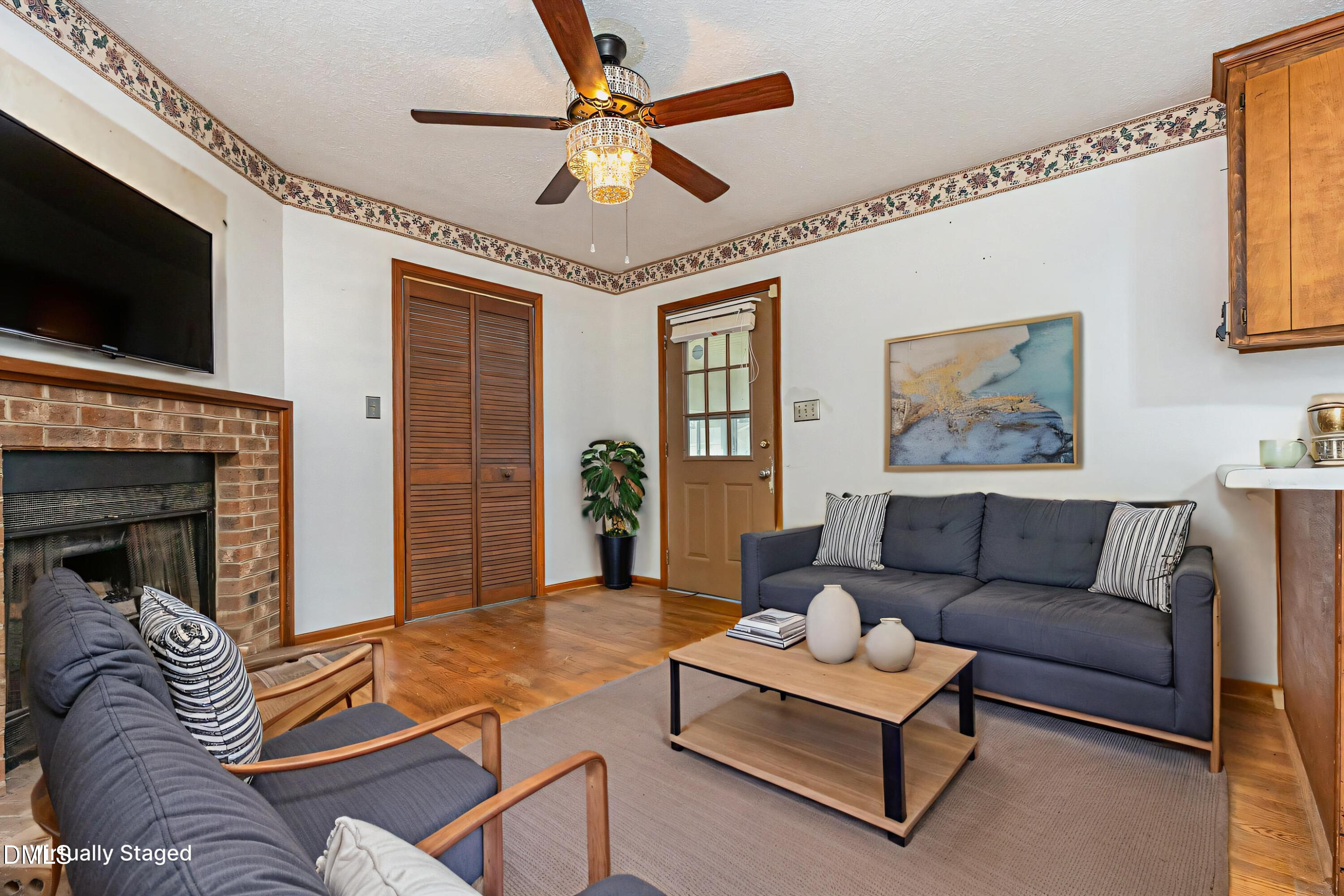 2111 Fieldcrest Road East Wilson, NC 27893 - Photo 7 of 37 a living room with furniture and a flat screen tv