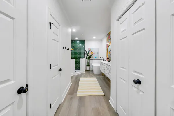 a view of a hallway with a white walls