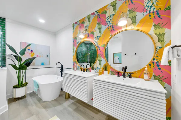 a living room with a couch and potted plant