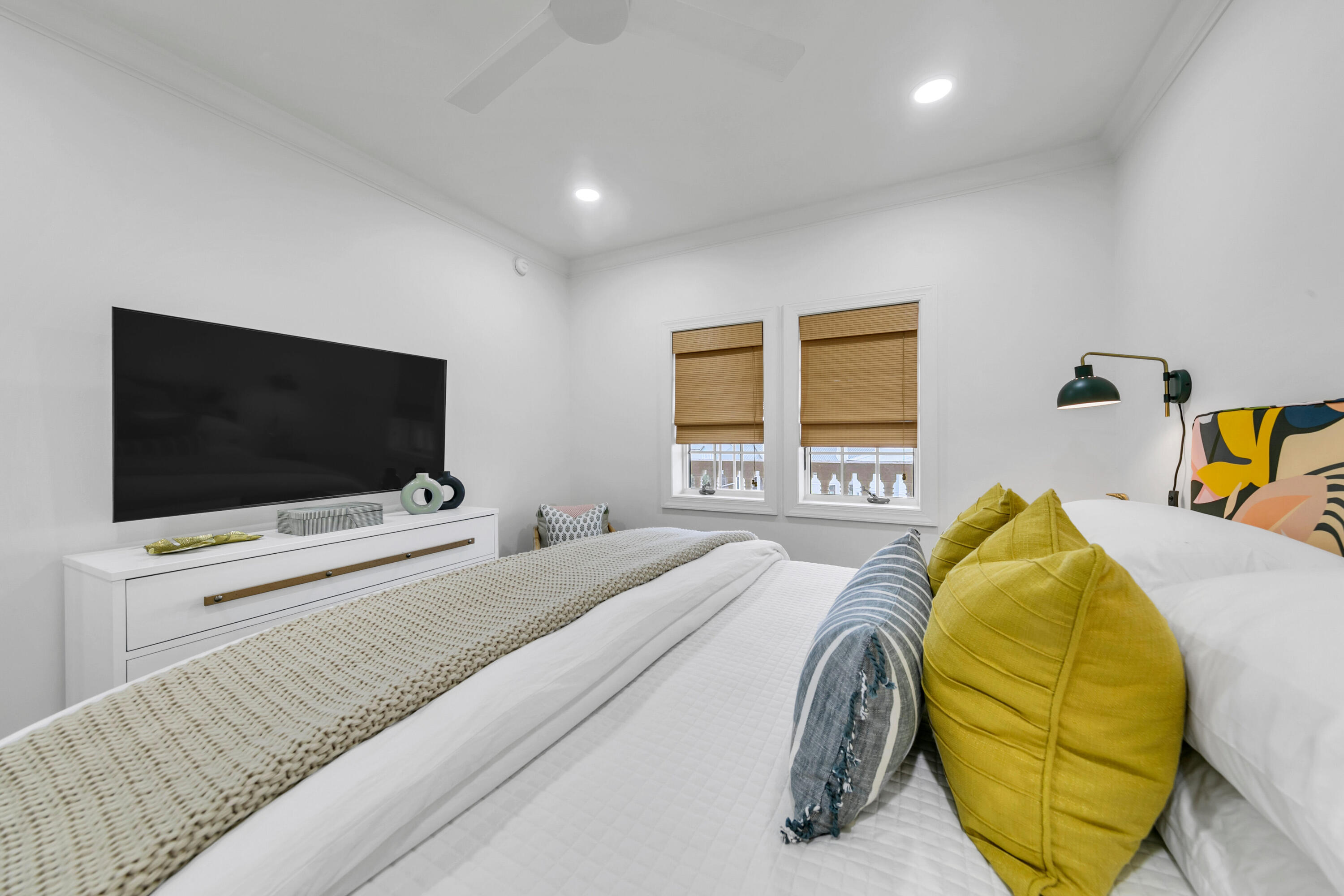 10343 East County Highway 30A, Unit E402 Inlet Beach, FL 32413 - Photo 22 of 34 a bedroom with a bed and a flat screen tv