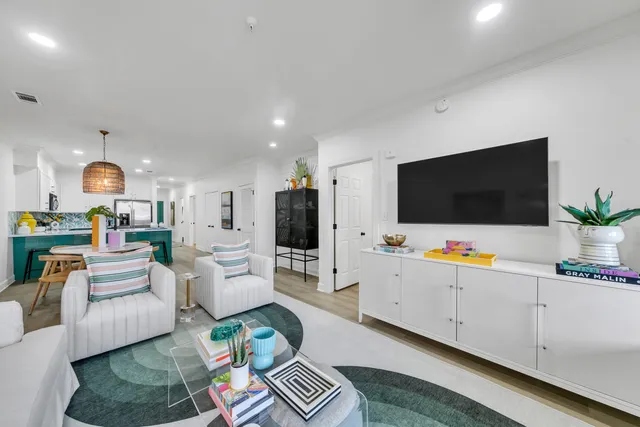 a living room with furniture and a flat screen tv
