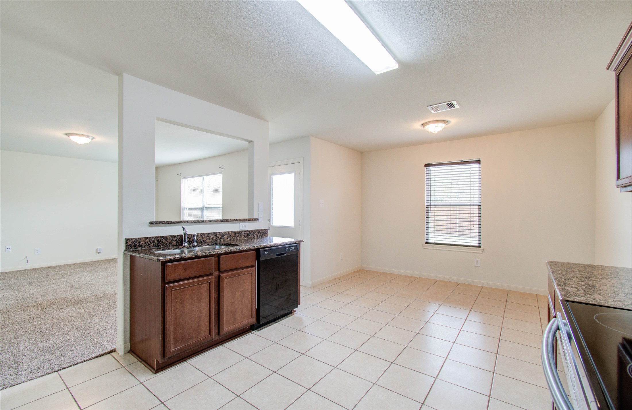 8218 Hall View Drive Houston, TX 77075 - Photo 11 of 31 a kitchen with stainless steel appliances granite countertop a stove and a sink