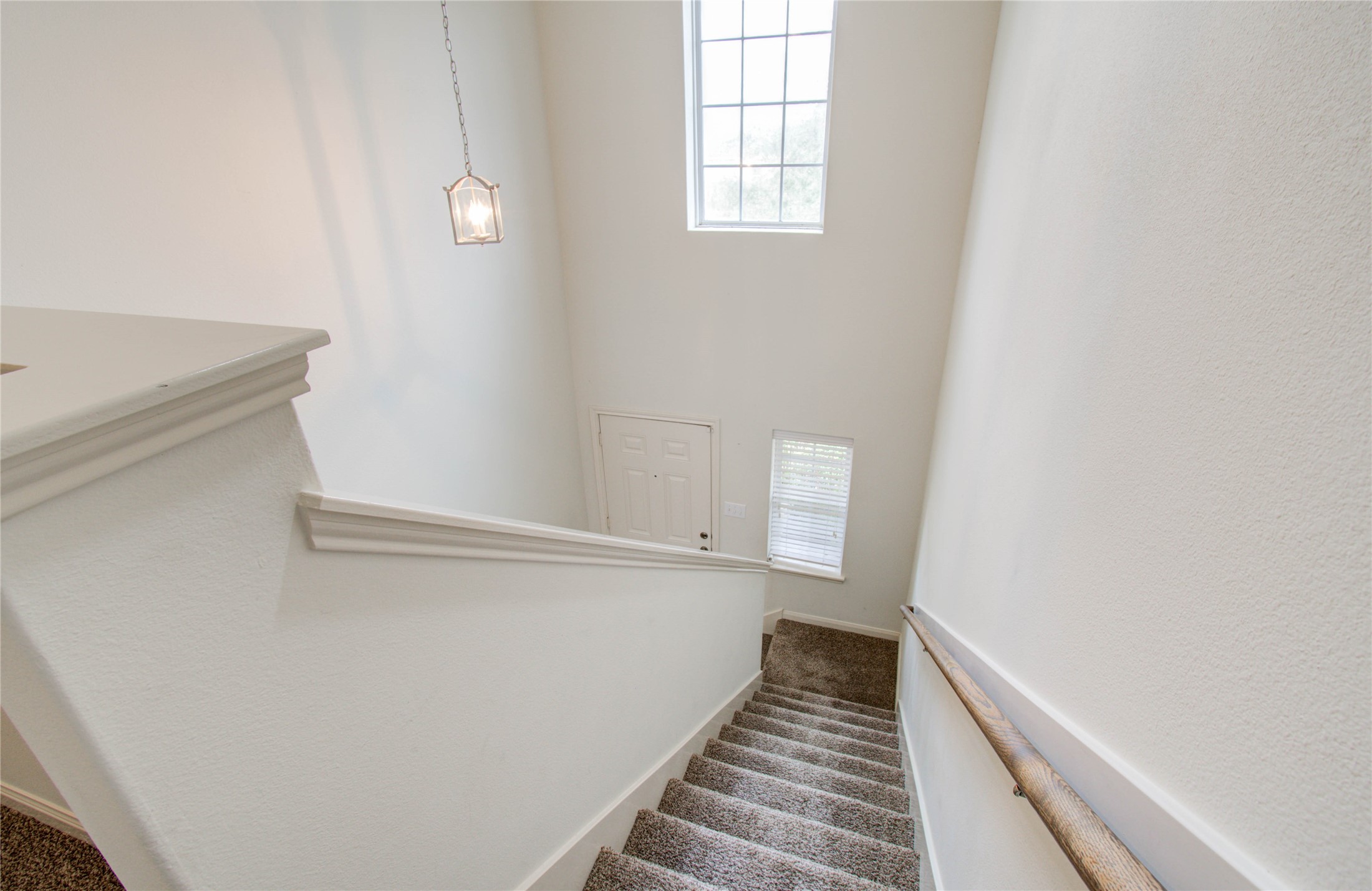 8218 Hall View Drive Houston, TX 77075 - Photo 16 of 31 a view of a hallway with wooden floor and staircase