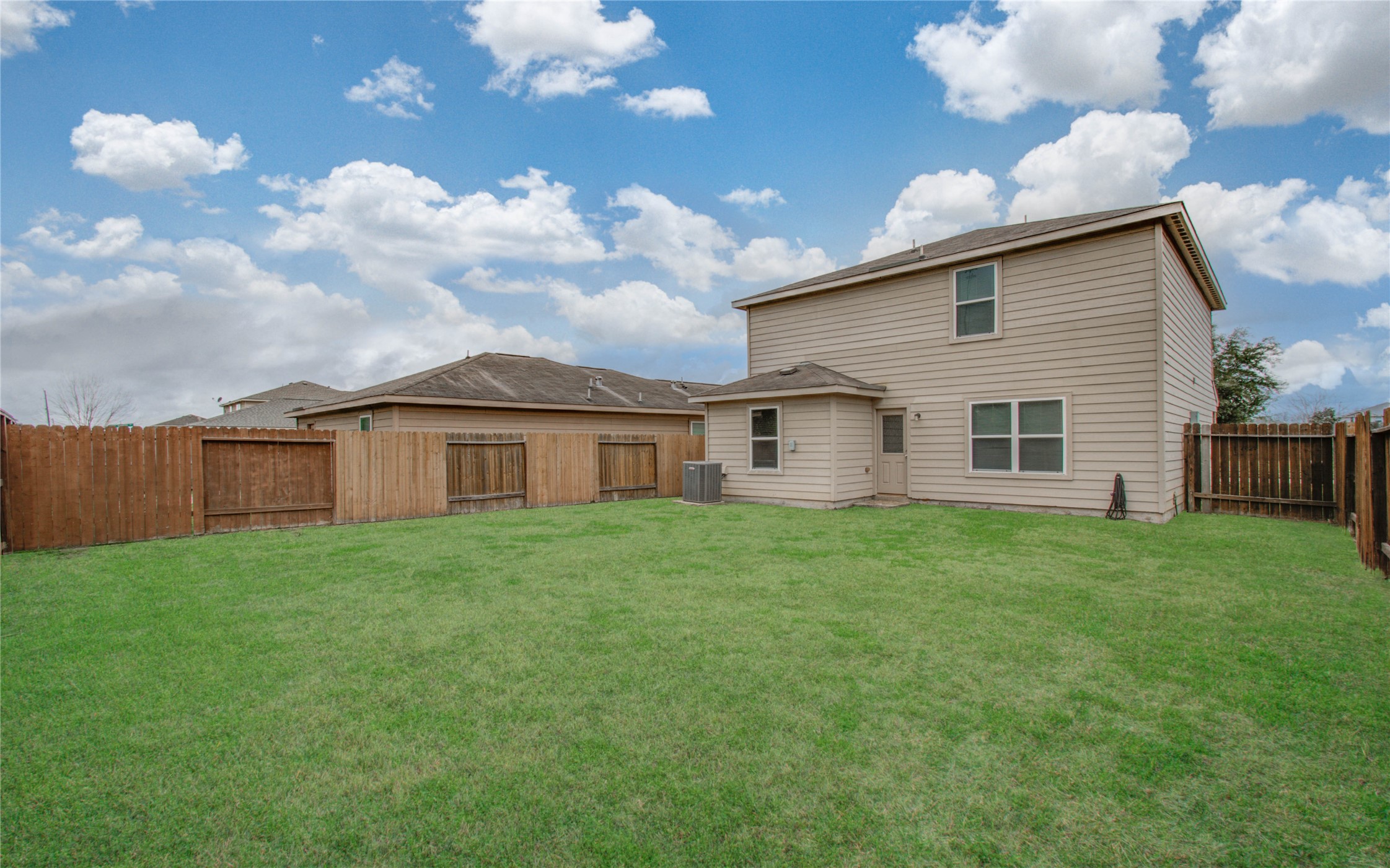 8218 Hall View Drive Houston, TX 77075 - Photo 30 of 31 a view of a yard in front of a house with a large garden