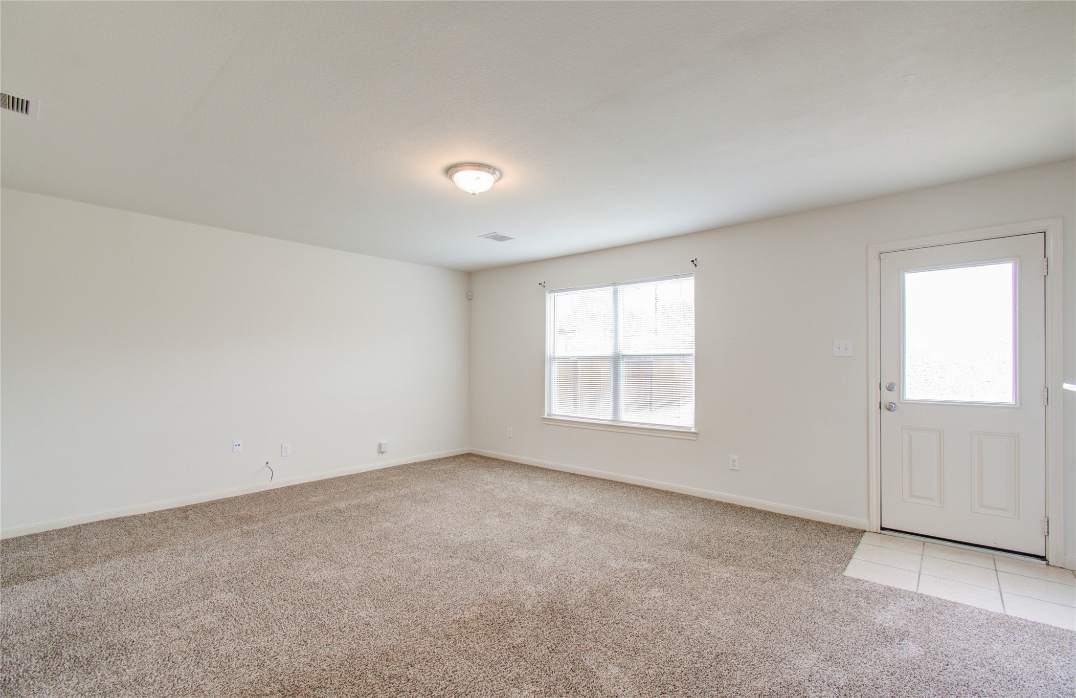 8218 Hall View Drive Houston, TX 77075 - Photo 8 of 31 an empty room with a empty space and windows
