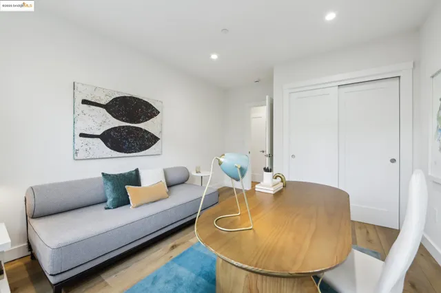 a living room with furniture and a lamp