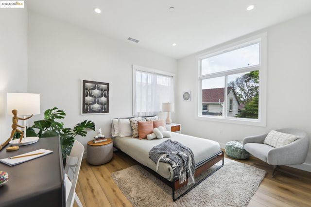 a bedroom with a bed and a couch