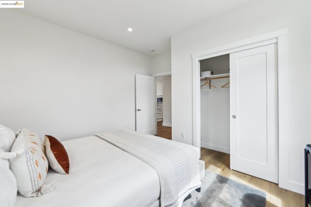 a bedroom with a bed and a view of bathroom