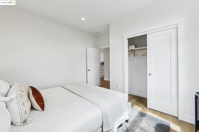 a bedroom with a bed and a view of bathroom