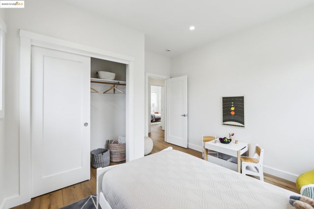 a bedroom with a bed and a table