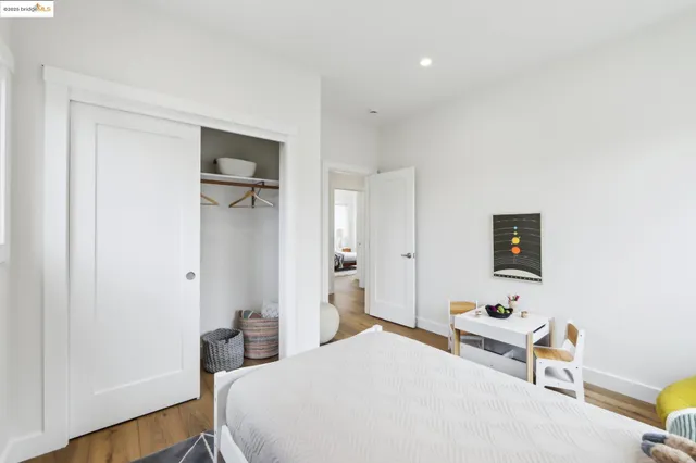 a bedroom with a bed and a table