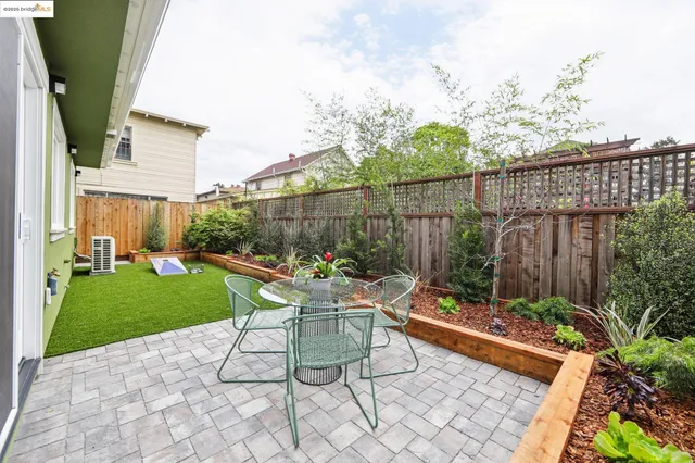 a chairs and table in the backyard