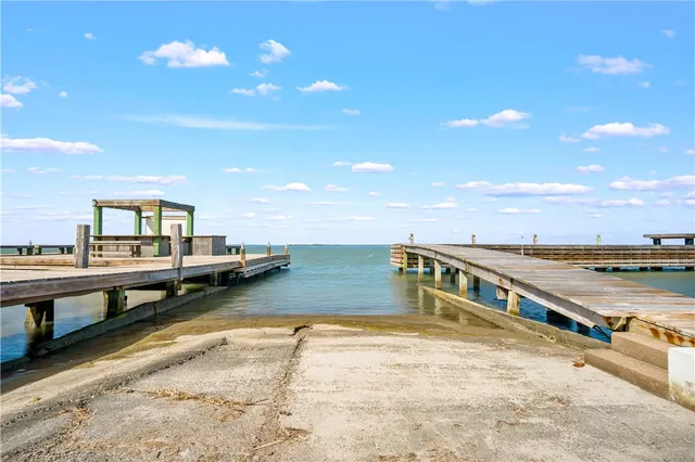 a view of balcony with seating space and wooden floor