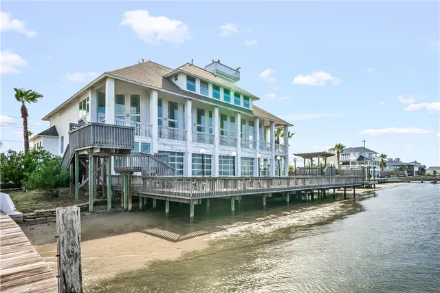a view of an entryway with wooden floor and door