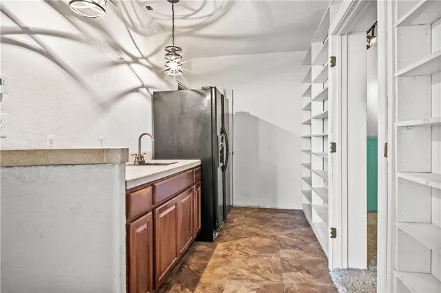 a view of a balcony with wooden floor and outdoor seating