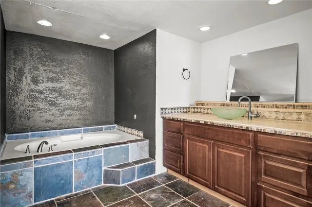 a view of a balcony with two chairs and a table