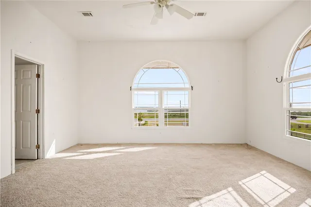 a view of a swimming pool with an outdoor seating