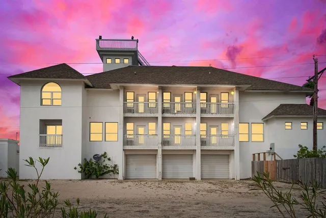 a view of a patio with a table and chairs
