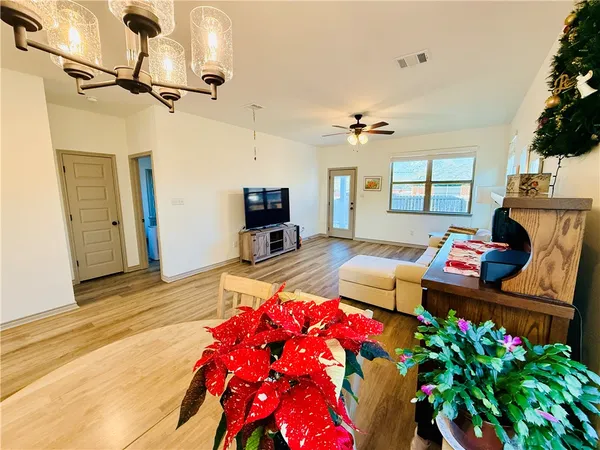 a bedroom with furniture and a flat screen tv