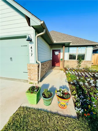 a front view of a house with yard