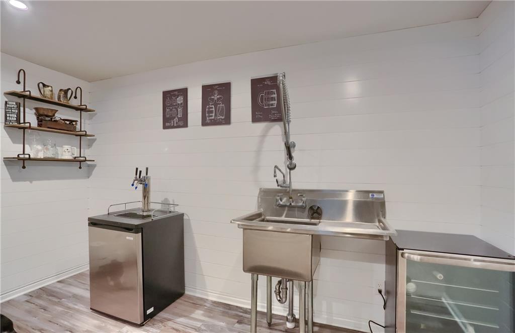 153 Piatt Estates Drive Washington, PA 15301 - Photo 35 of 50 Finished LL comes complete with a bar, sink area (kegerator and plug-in fridge do not included)