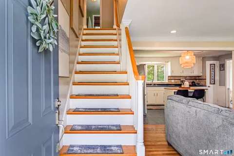 a view of a living room and entryway