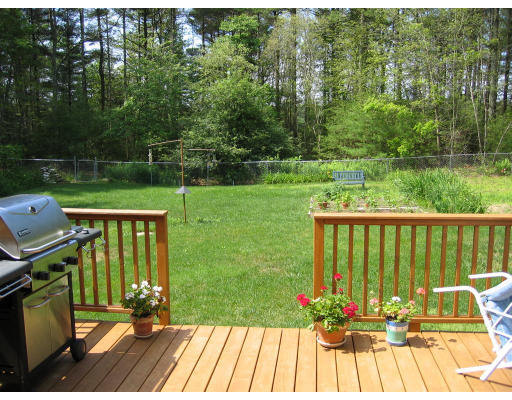 11 Randall Road Rochester, MA 02770 - Photo 11 of 11 a view of a deck with chair and garden view