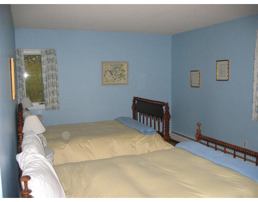 11 Randall Road Rochester, MA 02770 - Photo 10 of 11 a bedroom with a bed and a table
